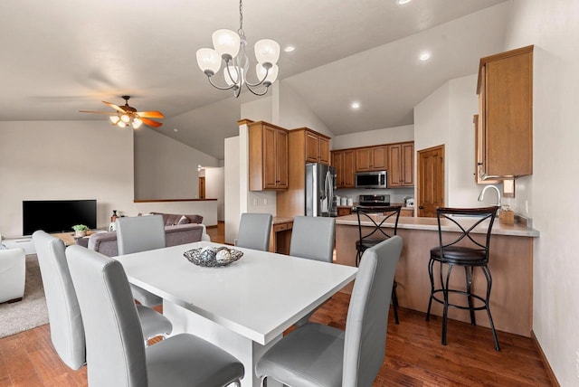 4835 Isabella Cir, Hobart, WI 54155 - dining area with lofted ceiling, wood finished floors, ceiling fan, a chandelier, and recessed lighting