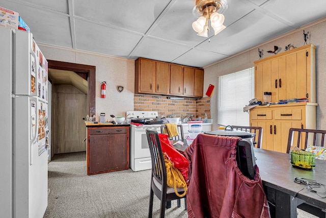 628 End Ct Unit 628A, Sheboygan, WI 53081 - kitchen with white appliances, light carpet, and a ceiling fan