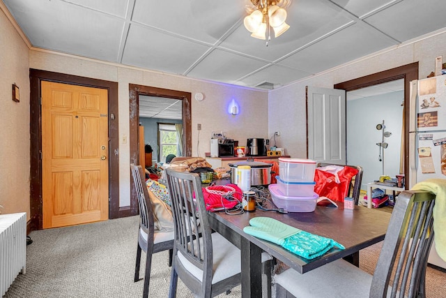628 End Ct Unit 628A, Sheboygan, WI 53081 - dining room featuring radiator heating unit, light carpet, and ceiling fan