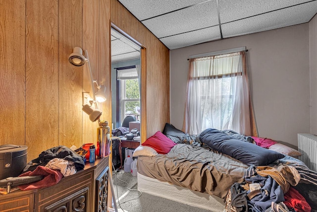 628 End Ct Unit 628A, Sheboygan, WI 53081 - bedroom featuring wood walls and carpet flooring