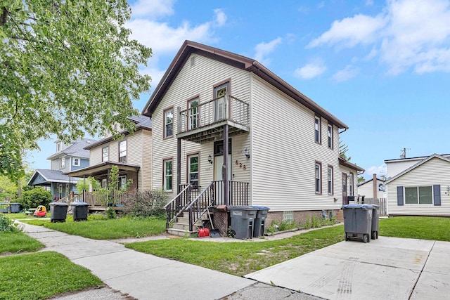 628 End Ct Unit 628A, Sheboygan, WI 53081 - view of front of home featuring a balcony and a front yard