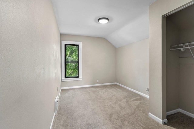 907 Lawe St, Kaukauna, WI 54130 - additional living space with vaulted ceiling and carpet floors