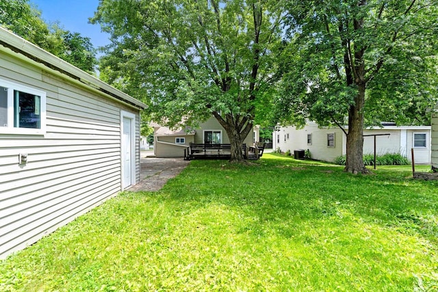 907 Lawe St, Kaukauna, WI 54130 - view of grassy yard with a deck
