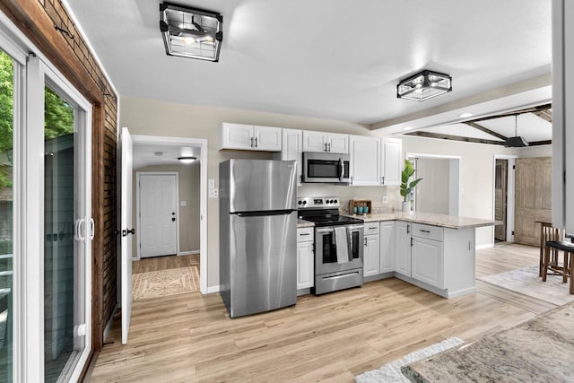 907 Lawe St, Kaukauna, WI 54130 - kitchen featuring appliances with stainless steel finishes, a peninsula, light wood-type flooring, white cabinetry, and beam ceiling
