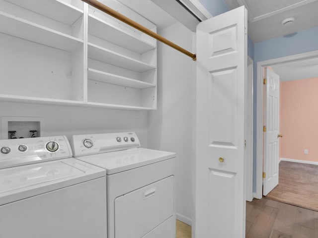 8300 Fishman Rd, Burlington, WI 53105 - laundry area with independent washer and dryer and light wood finished floors