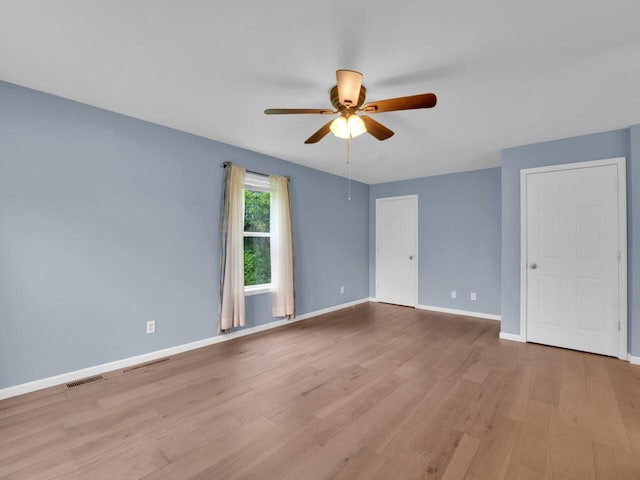 8300 Fishman Rd, Burlington, WI 53105 - empty room with a ceiling fan and wood finished floors