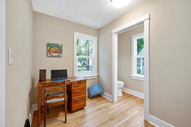 50 S Marquette St, Madison, WI 53704 - home office featuring light wood-type flooring and baseboards