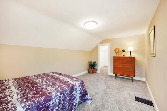 50 S Marquette St, Madison, WI 53704 - carpeted bedroom featuring lofted ceiling and baseboards
