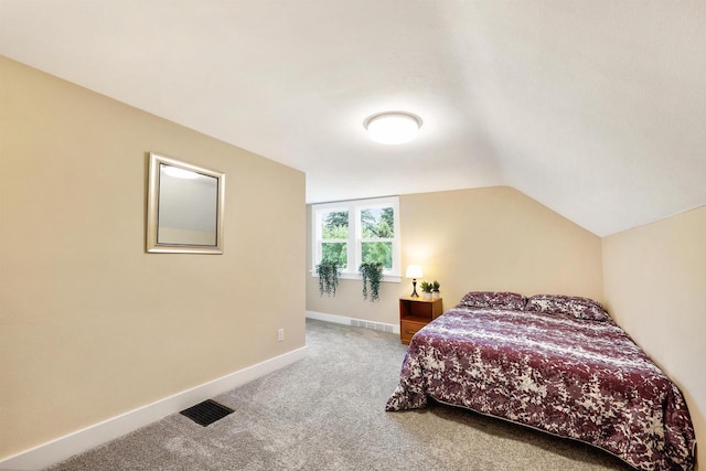 50 S Marquette St, Madison, WI 53704 - carpeted bedroom featuring vaulted ceiling and baseboards
