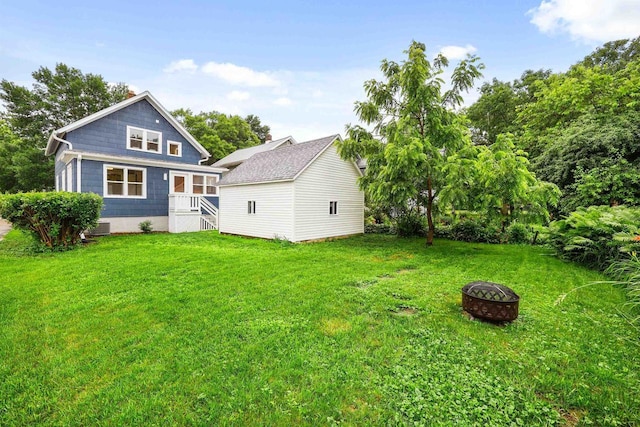 50 S Marquette St, Madison, WI 53704 - rear view of property featuring a fire pit and a yard