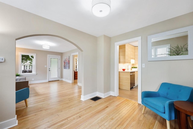 50 S Marquette St, Madison, WI 53704 - entryway with arched walkways and light wood-style floors
