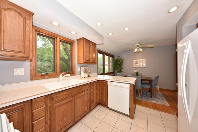 8535 N 59th St, Brown Deer, WI 53223 - kitchen with white appliances, brown cabinets, recessed lighting, a peninsula, and lofted ceiling