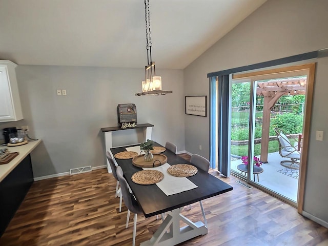 3201 Mockingbird Way, Oshkosh, WI 54904 - dining space with vaulted ceiling and wood finished floors