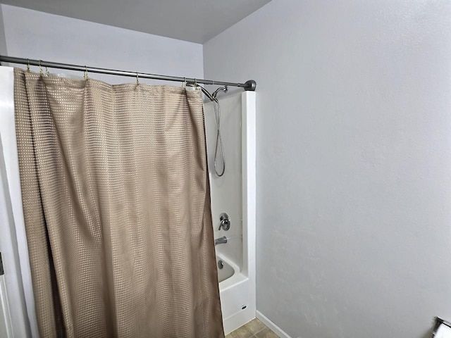 3201 Mockingbird Way, Oshkosh, WI 54904 - full bathroom with shower / bath combo with shower curtain and baseboards