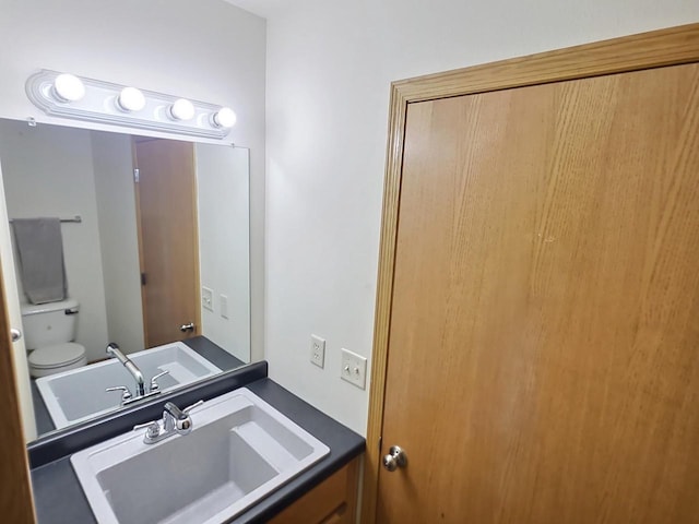 3201 Mockingbird Way, Oshkosh, WI 54904 - bathroom with toilet and vanity