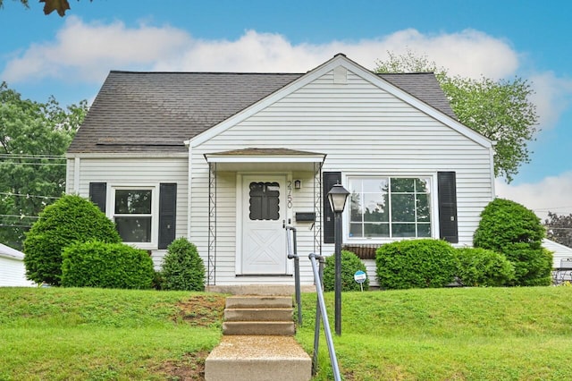 2750 N 86th St, Milwaukee, WI 53222 - view of front facade with a front lawn and roof with shingles