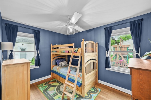 2750 N 86th St, Milwaukee, WI 53222 - bedroom with wood finished floors, multiple windows, and a ceiling fan