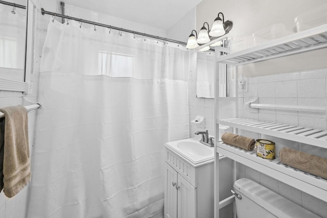 2750 N 86th St, Milwaukee, WI 53222 - bathroom with vanity, tile walls, and a shower with curtain