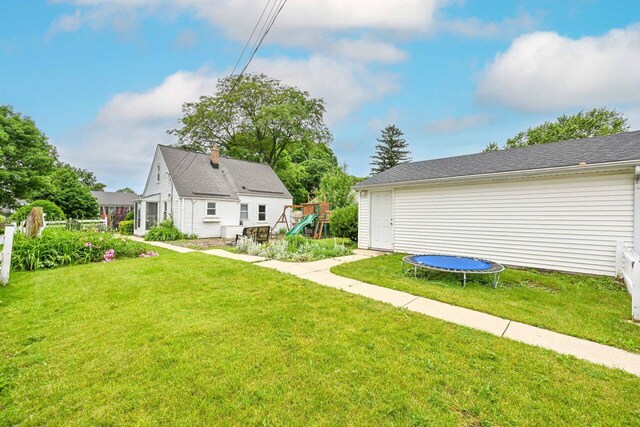2750 N 86th St, Milwaukee, WI 53222 - view of green lawn with a trampoline and a playground