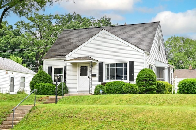 2750 N 86th St, Milwaukee, WI 53222 - bungalow-style house with a front yard and a shingled roof