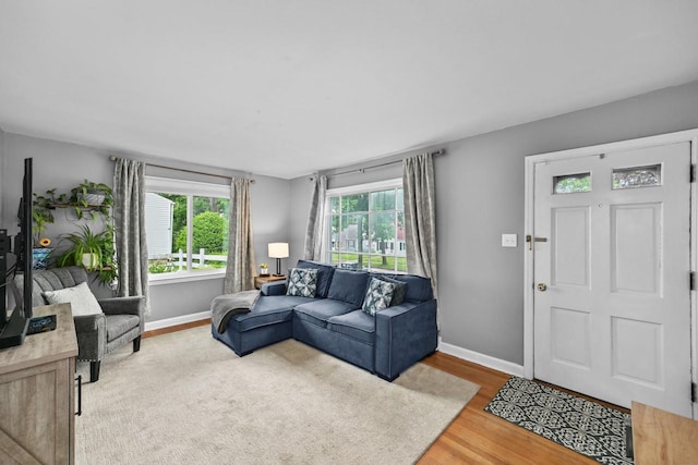 2750 N 86th St, Milwaukee, WI 53222 - living room featuring baseboards and wood finished floors