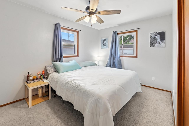 605 E 10th St, Fond Du Lac, WI 54935 - bedroom with multiple windows, light colored carpet, and a ceiling fan