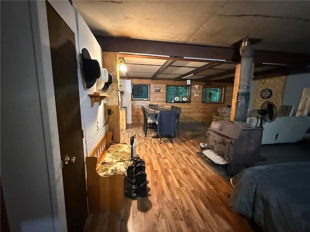 1330A 21 3/4 St, Cameron, WI 54822 - living area featuring a wood stove, wood finished floors, and wood walls