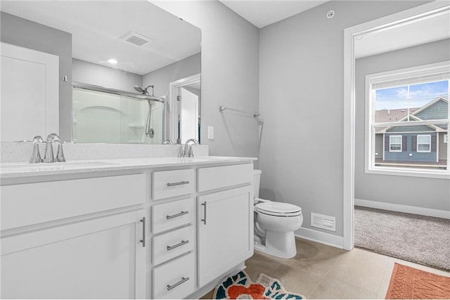 7243 Fall Dr, Hugo, MN 55038 - full bath with double vanity, an enclosed shower, and tile patterned floors