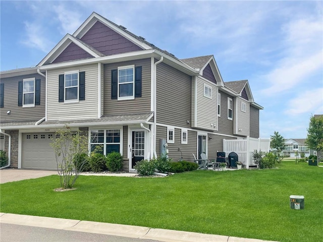 7243 Fall Dr, Hugo, MN 55038 - townhome / multi-family property with a front yard, a garage, and driveway