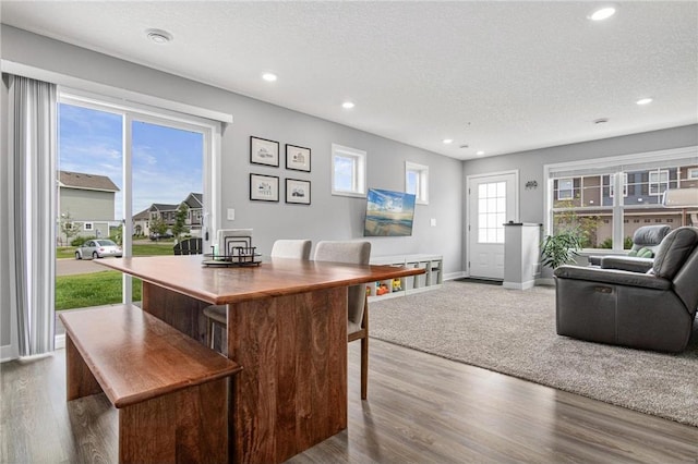 7243 Fall Dr, Hugo, MN 55038 - home office with recessed lighting, a textured ceiling, and wood finished floors