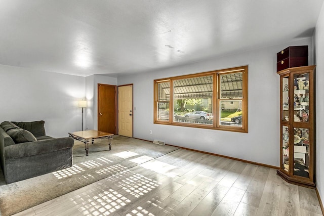 1128 S 62nd St, West Allis, WI 53214 - living area featuring baseboards and light wood-type flooring