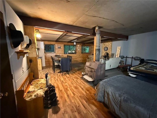 1330 21 3/4 St Unit A, Cameron, WI 54822 - bedroom featuring a wood stove and wood finished floors