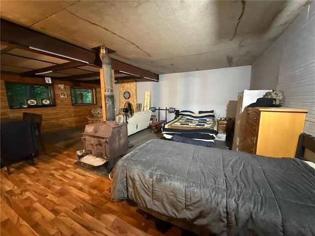 1330 21 3/4 St Unit A, Cameron, WI 54822 - bedroom featuring wood finished floors, a wood stove, and wood walls
