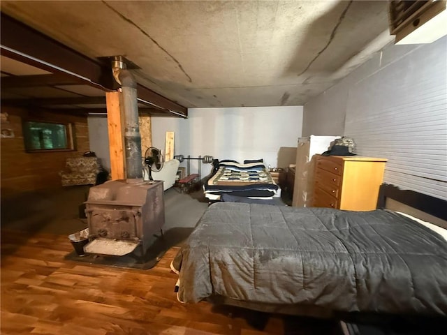 1330 21 3/4 St Unit A, Cameron, WI 54822 - bedroom with a wood stove and wood finished floors