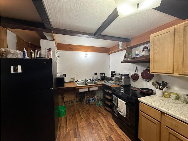 1330 21 3/4 St Unit A, Cameron, WI 54822 - kitchen featuring black appliances, wood finished floors, open shelves, light countertops, and under cabinet range hood