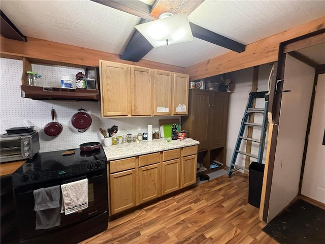 1330 21 3/4 St Unit A, Cameron, WI 54822 - kitchen featuring black range with electric cooktop, light wood-type flooring, light countertops, under cabinet range hood, and open shelves