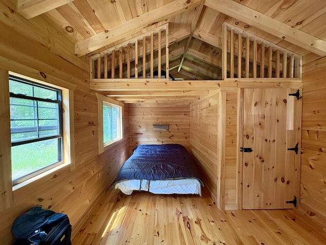 76557 Deringer Rd, Glidden, WI 54527 - bedroom featuring lofted ceiling, wood ceiling, wood walls, and wood-type flooring