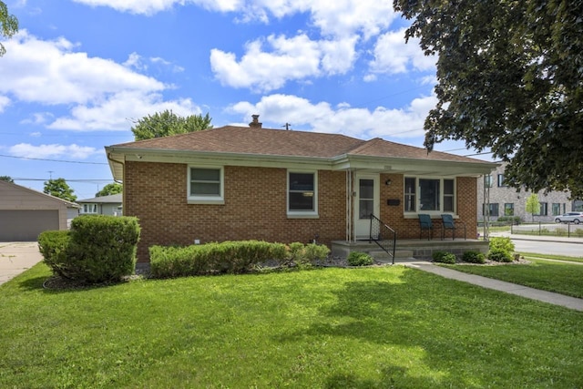 1002 Grove St, Oshkosh, WI 54901 - single story home featuring brick siding, a front lawn, a porch, roof with shingles, and a chimney