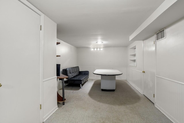 1002 Grove St, Oshkosh, WI 54901 - living area featuring wainscoting, a decorative wall, and carpet flooring