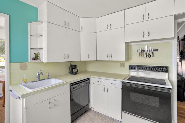 1002 Grove St, Oshkosh, WI 54901 - kitchen with electric stove, dishwasher, light countertops, and white cabinets