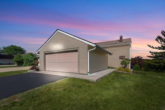 618 Westridge Dr, West Bend, WI 53095 - view of front of house with a chimney, a garage, a yard, an outdoor structure, and driveway