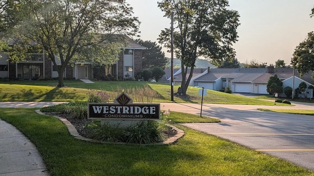 618 Westridge Dr, West Bend, WI 53095 - community sign with a lawn and a residential view