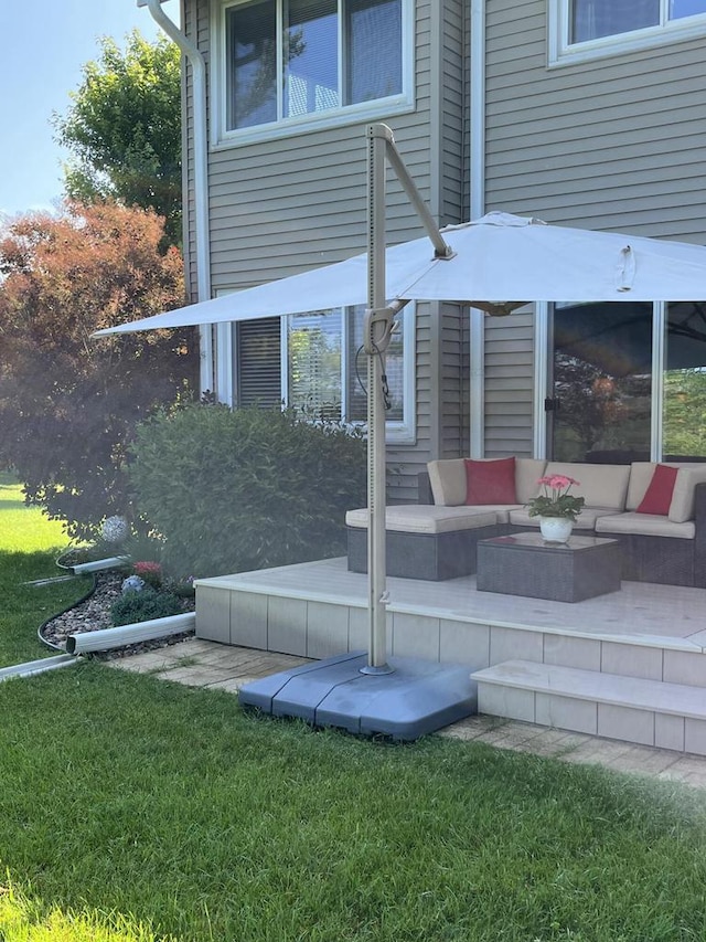 618 Westridge Dr, West Bend, WI 53095 - rear view of house featuring an outdoor living space and a lawn