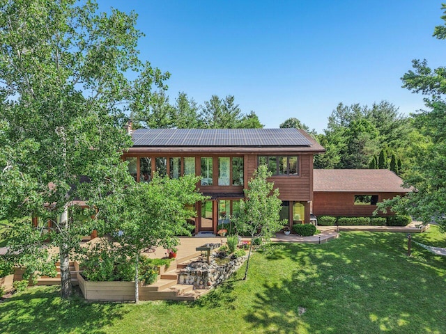 W318S4121 Highview Rd, Waukesha, WI 53189 - back of house with a yard, a vegetable garden, and solar panels