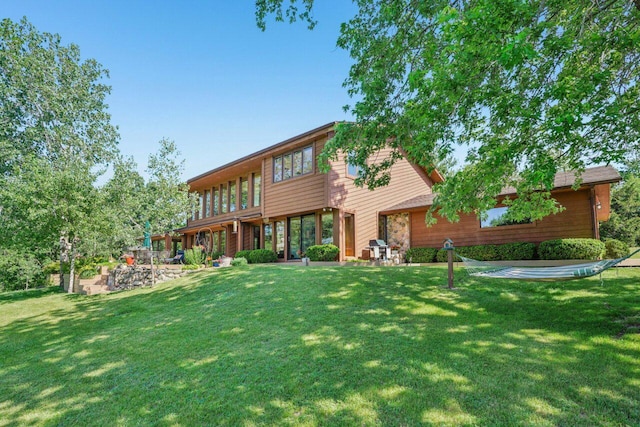 W318S4121 Highview Rd, Waukesha, WI 53189 - rear view of property with a lawn and a patio area