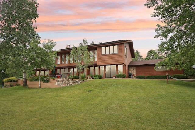 W318S4121 Highview Rd, Waukesha, WI 53189 - back of house at dusk with a patio area and a yard