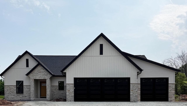 2584 N Stellita Cir, De Pere, WI 54115 - modern farmhouse featuring stone siding, roof with shingles, a garage, board and batten siding, and driveway