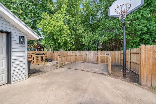 500 S Pierce Ave, Appleton, WI 54914 - fenced backyard featuring a deck and view of scattered trees