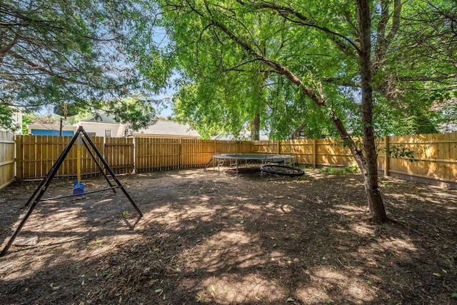 500 S Pierce Ave, Appleton, WI 54914 - fenced backyard with a trampoline and a playground