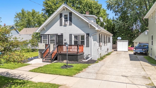 500 S Pierce Ave, Appleton, WI 54914 - view of front of house with concrete driveway, a deck, and a chimney